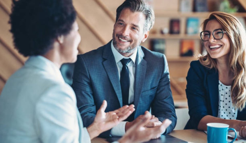 Business persons talking in the office